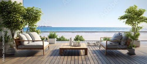 Coastal terrace and living space in featuring wooden floors and rattan furniture © 2rogan