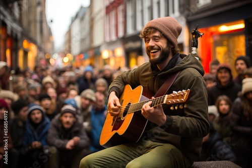 Singer playing the guitar on a street concert