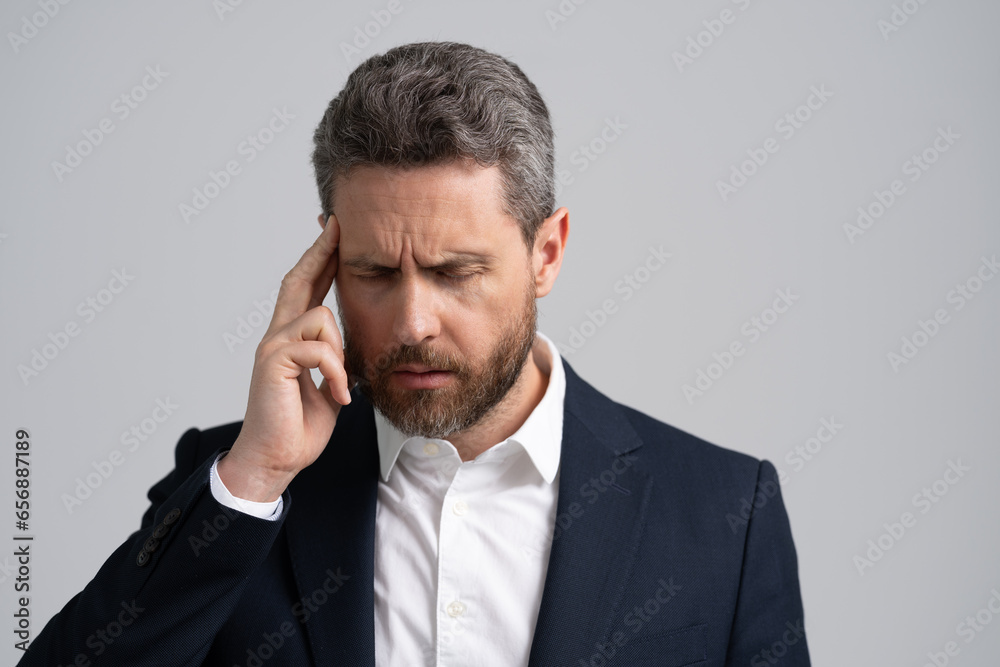 Headache and stress of businessman having burnout at business and suffering from migraine and tension Headache and stress of businessman having burnout at business and suffering from migraine and tension
