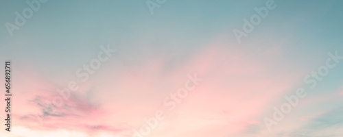 Pastel gradient blurred sky with cloud, sunset background. Soft focus sunshine bright peaceful morning summer. Rays light clean beach outdoor. Open view relax landscape spring cloud. photo