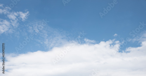 Fototapeta Naklejka Na Ścianę i Meble -  blue sky background with copy space and white band of clouds below