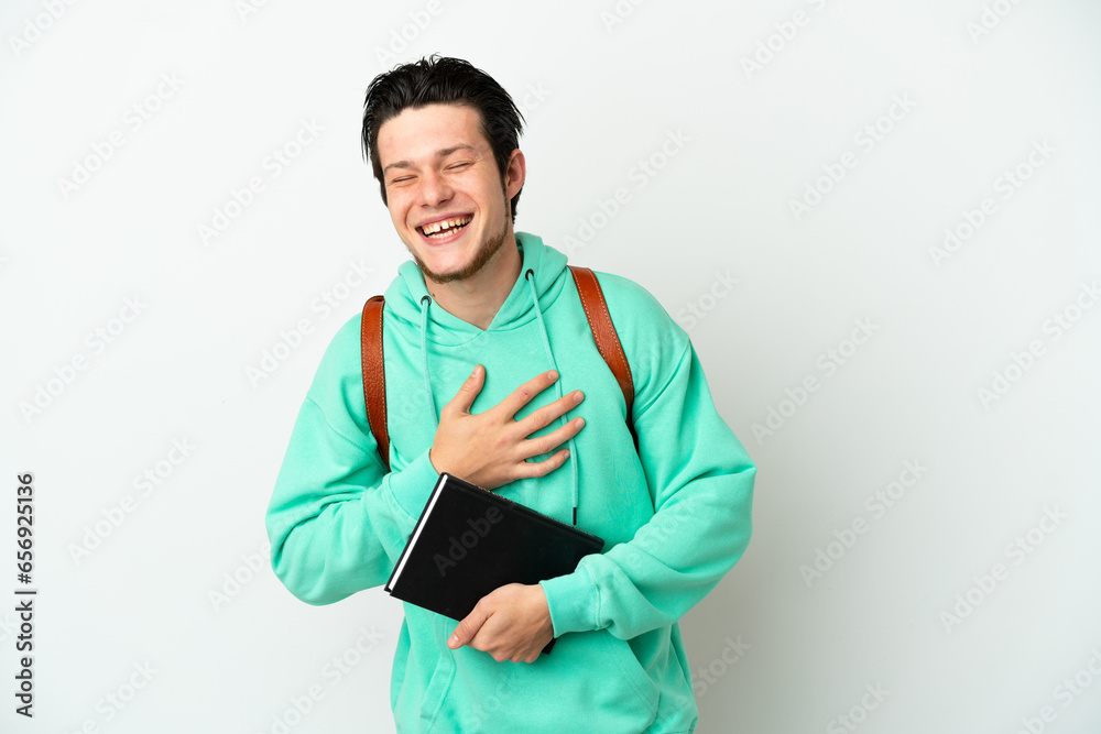 Young student man isolated on white background smiling a lot Young student man isolated on white background smiling a lot