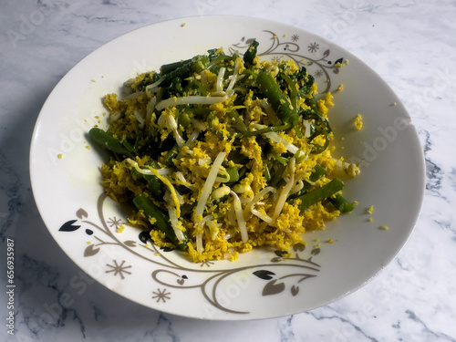 Indonesian traditional food urap sayur is a salad dish of steamed various vegetables mixed with seasoned and spiced grated coconut photo