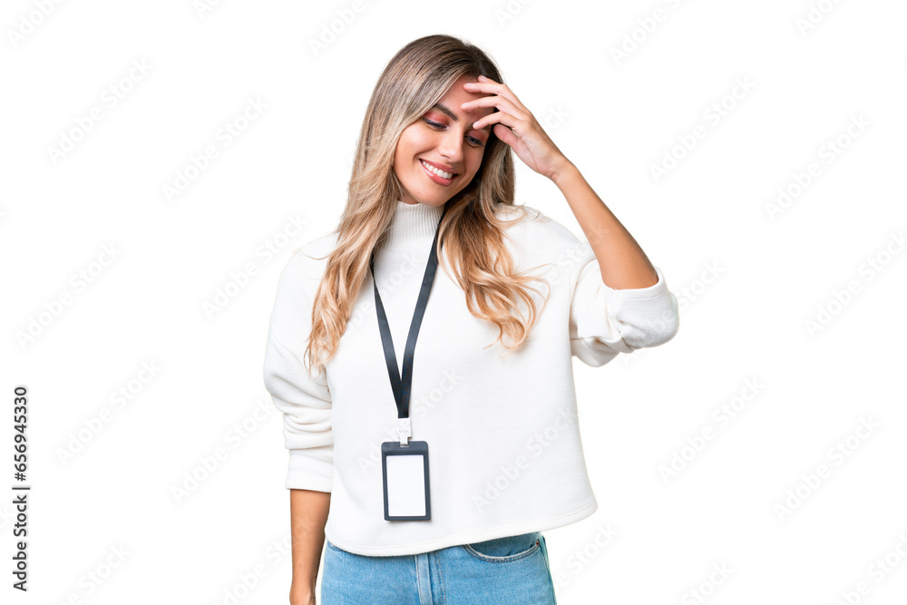 Fototapeta premium Young Uruguayan woman with ID card over isolated background laughing