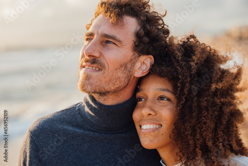 Loving couple spending leisure time at beach