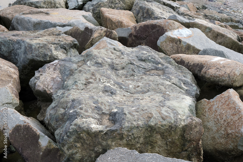 Large gray stones or on the seashore.