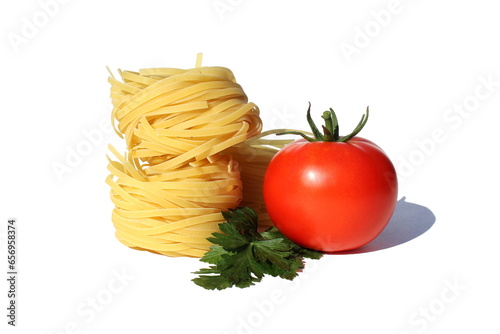 Round spaghetti in the form of a nest with red ripe tomatoes lies on a white background.