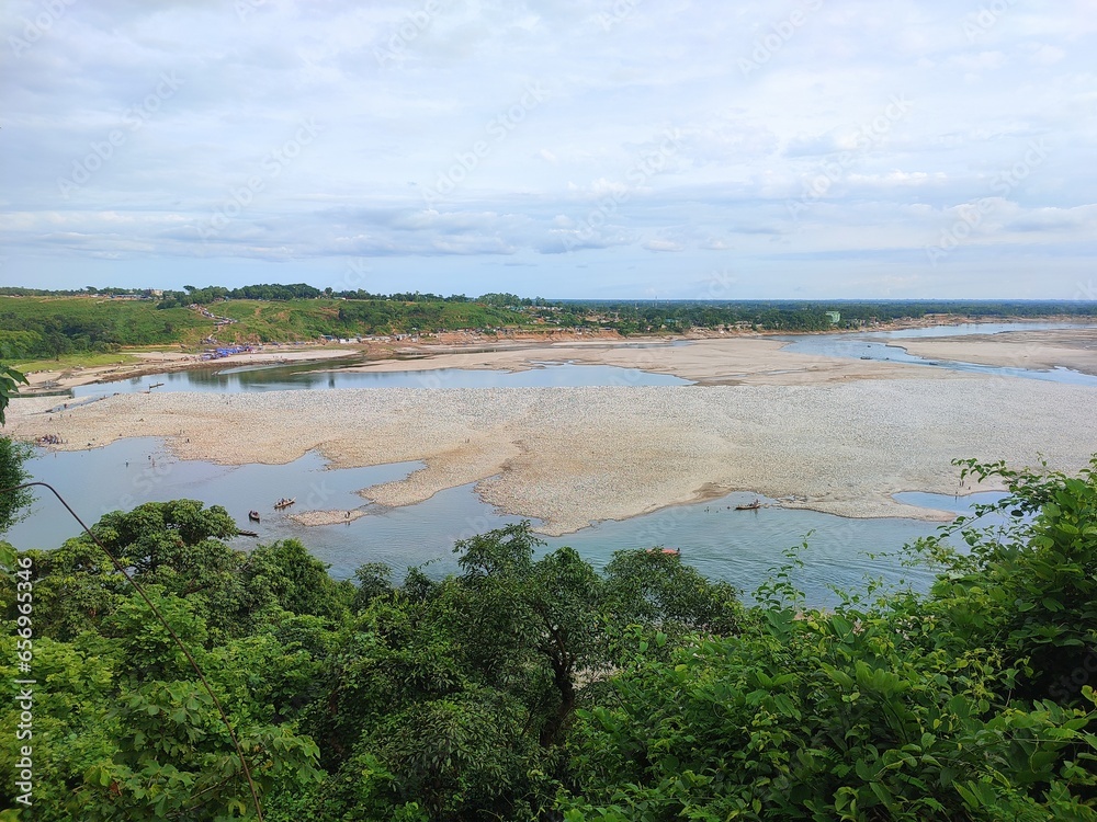 Nature's Majesty: A Serene Oasis of Pristine Waters Flowing through Majestic Woodlands