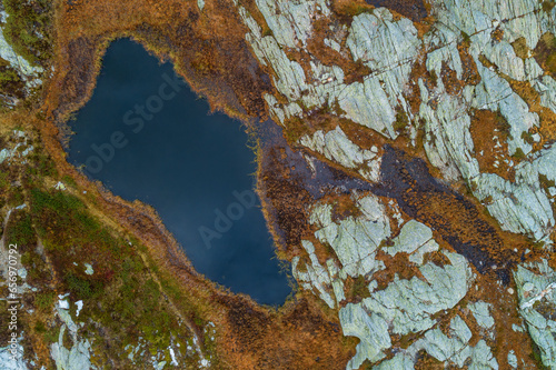 Switzerland, Graubunden Canton, Aerial view of small alpine lake in San Bernardino Pass area photo