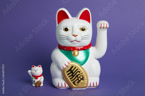 a couple mother and baby of Maneki-neko plastic cat