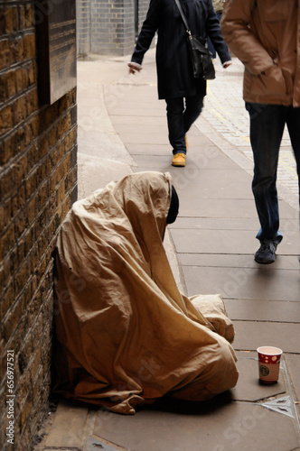 Cold, alone, miserable, under a blanket.