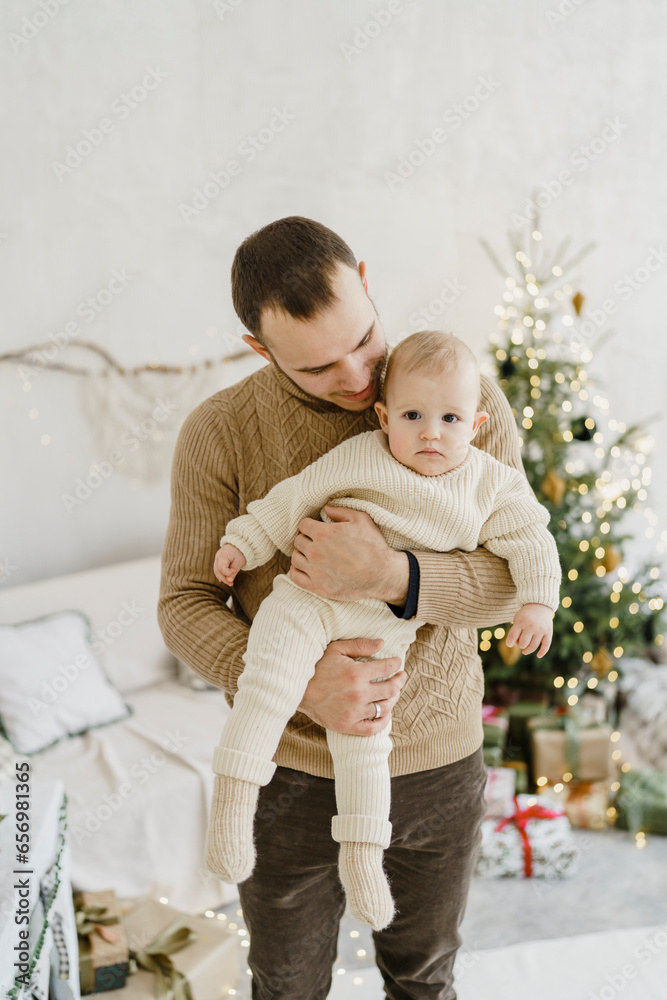 Father carrying baby daughter at home Father carrying baby daughter at home