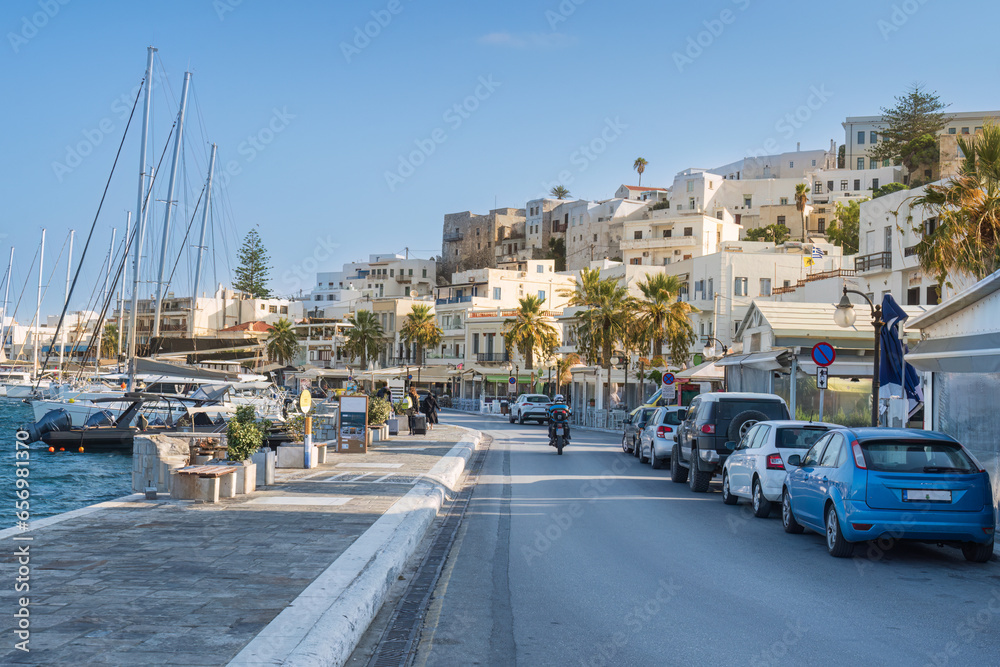 The main road through Naxos Town on the island of Naxos one of the Cyclades islands in Greece - obrazy, fototapety, plakaty 
