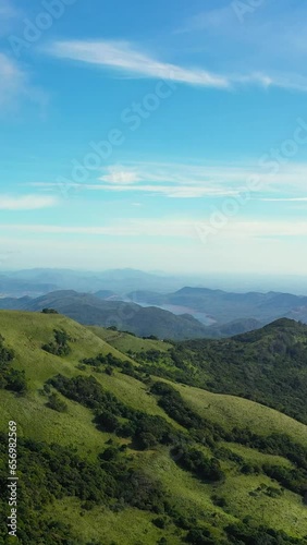 Tropical green forest in the mountains and jungle hills in the highlands of Sri Lanka. Riverston, Sri Lanka. Vertical video. photo