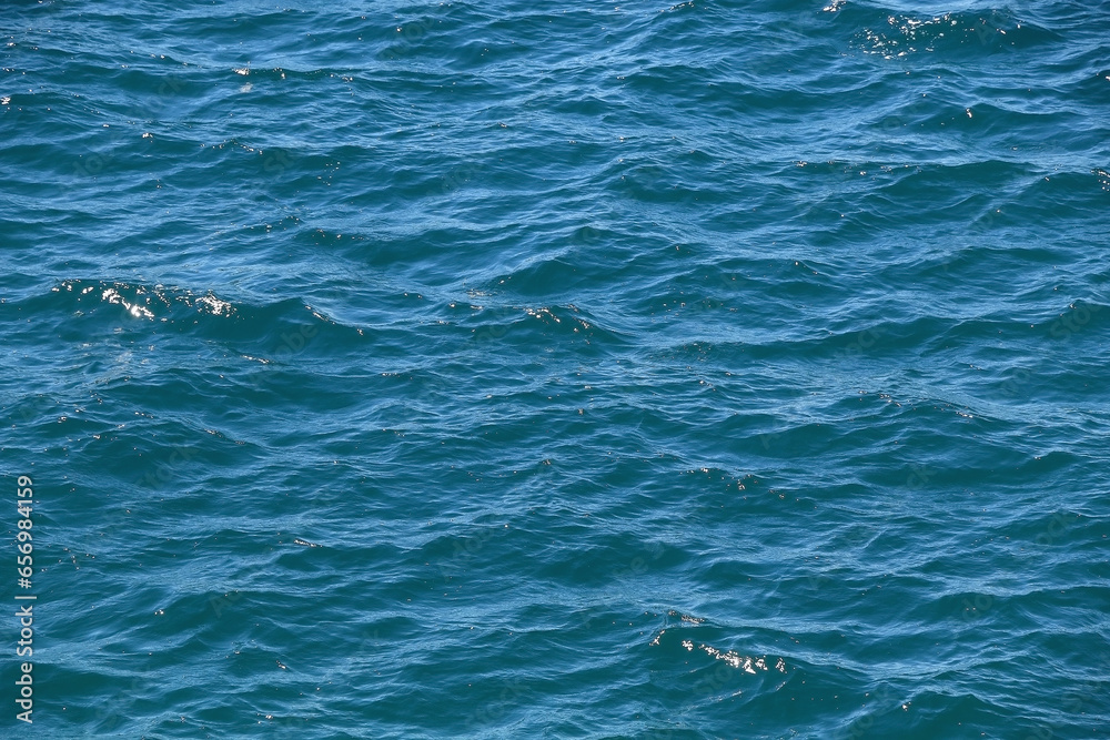 Fototapeta premium Bright blue sea surface, close-up.
