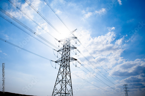 electric pole, power line with blue sky on the background, electricity.