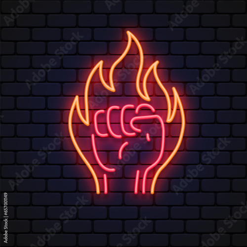 Flaming red fiery fist emblem Neon Sign. Symbol strength, power vector illustration