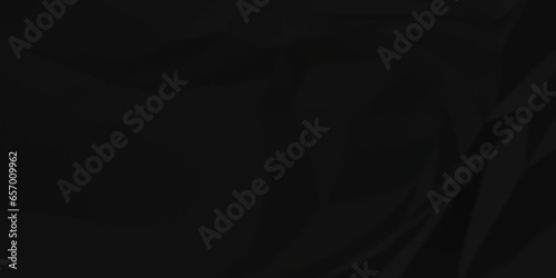 Dark crumple black fabric paper wrinkled poster template ,blank glued creased paper texture background. black paper crumpled backdrop background. used for cardboard and clarkboard. 