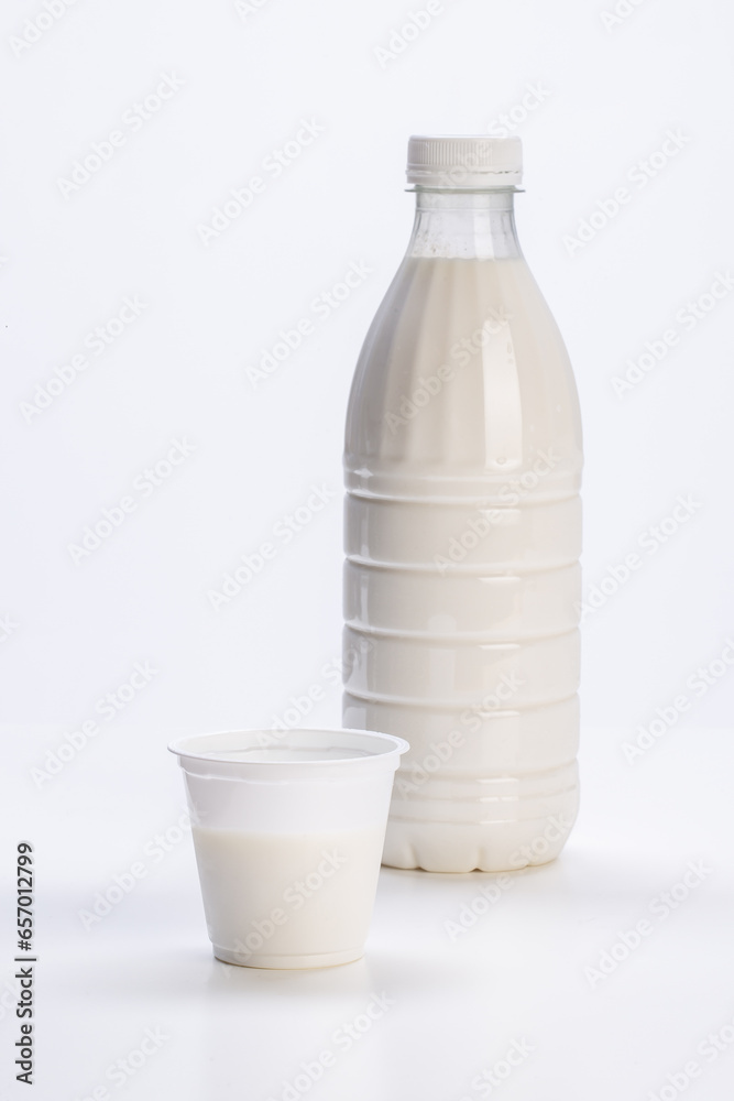 fresh milk in plastic bottle with yogurt jar on white background fresh milk in plastic bottle with yogurt jar on white background