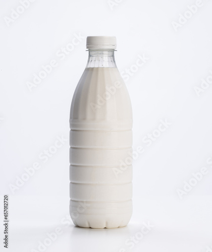fresh milk in plastic bottle on white background