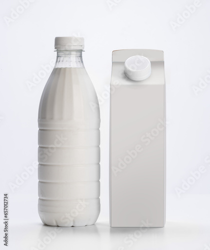 milk in plastic bottle and milk carton on white background