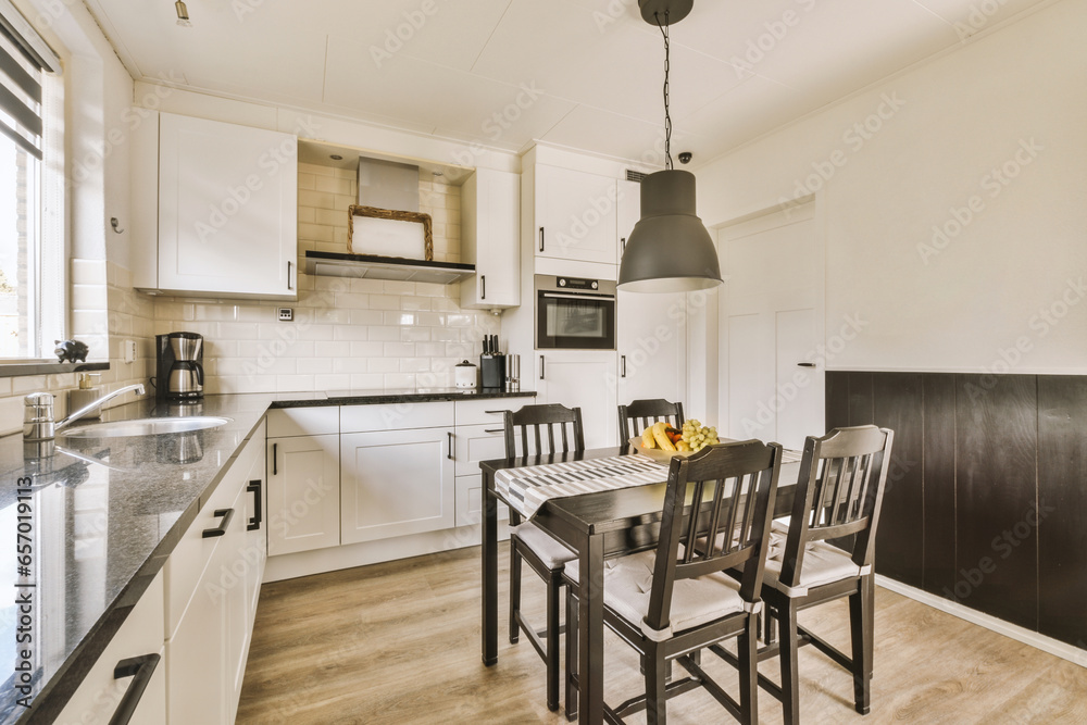 Contemporary kitchen with wooden dining table and chairs Contemporary kitchen with wooden dining table and chairs