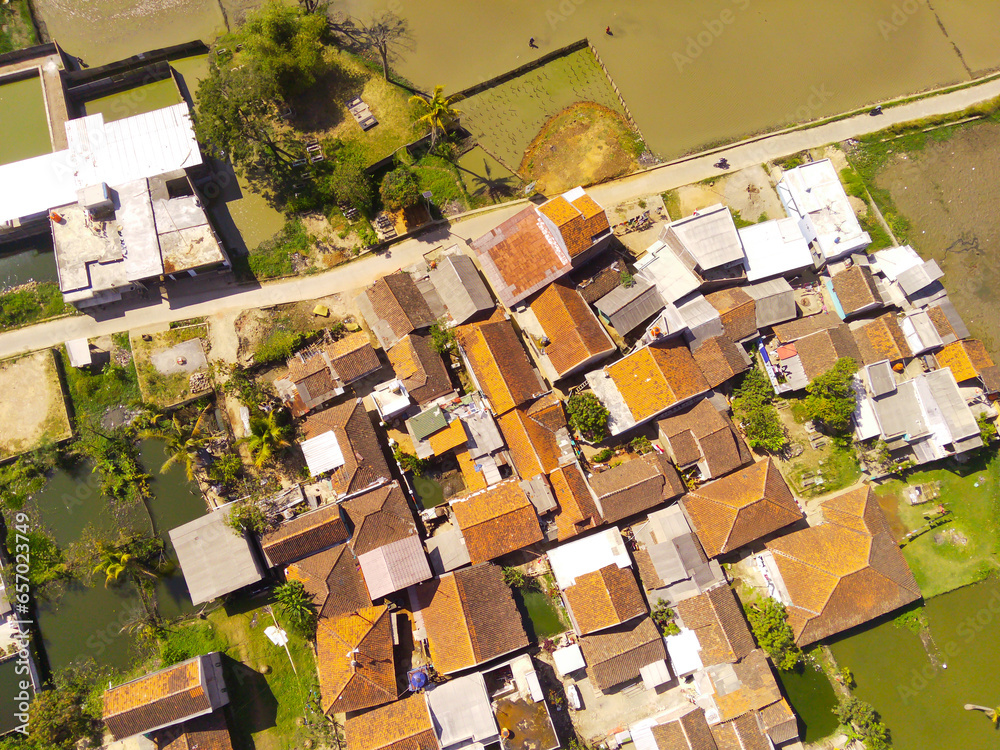 Residential Housing. Aerial drone shot landscape view of densely populated housing in a village at the foot of Mount Pangradinan - Bandung, Indonesia. Dense housing, Aerial Landscape Residential Housing. Aerial drone shot landscape view of densely populated housing in a village at the foot of Mount Pangradinan - Bandung, Indonesia. Dense housing, Aerial Landscape