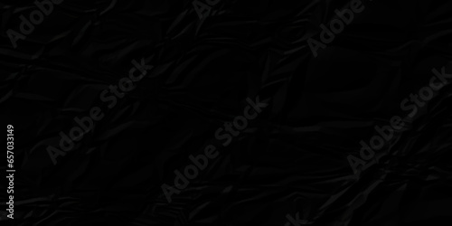 Black crumpled paper texture. Black crumpled paper texture sheet background. Wrinkled paper texture.
