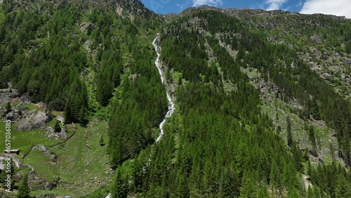 Venter tal Lehnenbach waterfall view at Heiligkreuz in the Otztal region of Tiol in the Austrian Alps during a beautiful springtime day in the mountains.  photo