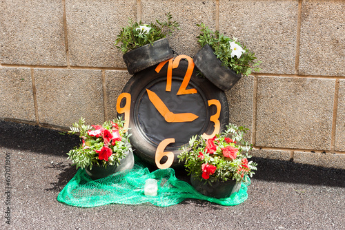 Clock made with car tires and flowers on "Costitx en Flor" (Costitx in bloom) Flower Fair, Majorca, Spain