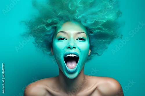 Colorful studio portrait of a beautiful young woman with excited expression, deep blue and mint. Generative AI photo