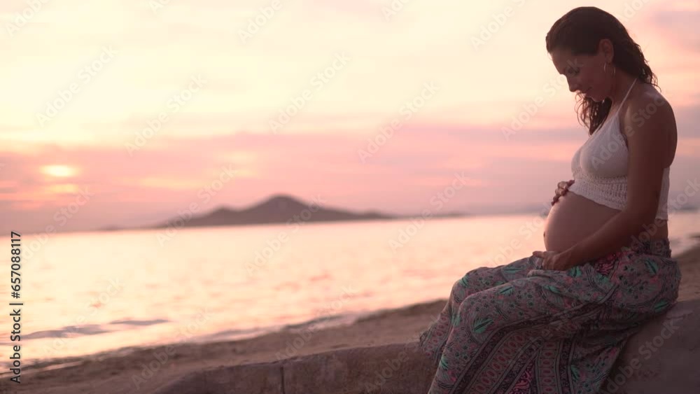 Serene sunset moment for expecting mother at the beach Serene sunset moment for expecting mother at the beach