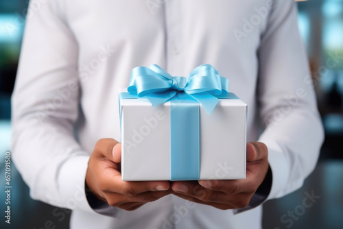 Surprise Delivery: Executive with White Gift Box in Office © AIproduction