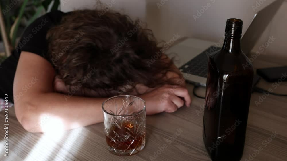 alcoholism, alcohol addiction . drunk woman or female alcoholic drinking whiskey at home. Loneliness and stress. Female alcoholism