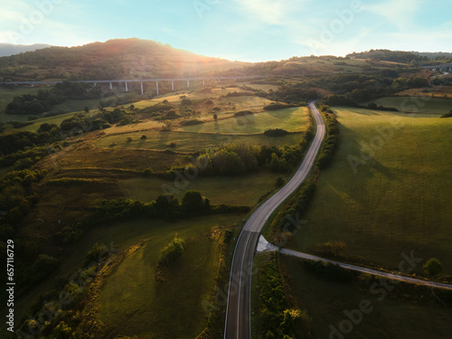 Drone view of an typical Italian hills at dawn, the sun rises against the backdrop of the Italian hills photo