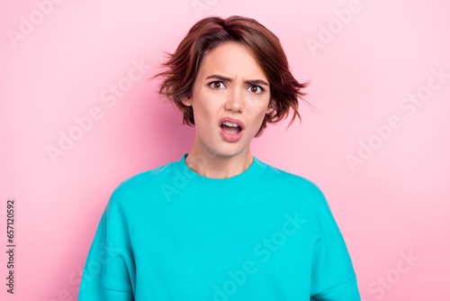 Photo of impressed pretty young lady open mouth staring disbelief confusion isolated on bright pink color background