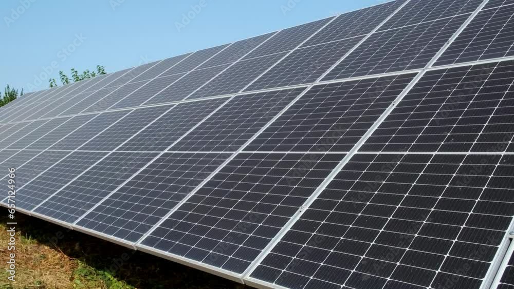 Closeup of surface of blue photovoltaic solar panels mounted on building roof for producing clean ecological electricity. Production of renewable energy concept. Closeup of surface of blue photovoltaic solar panels mounted on building roof for producing clean ecological electricity. Production of renewable energy concept.