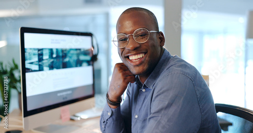 African man, portrait and computer in office at investing agency with smile for pride, finance or knowledge. Happy trader, excited face and black business owner in workplace, research or stock market