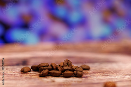 A handful of coffee beans on a beautiful background. Coffee beans on the table.