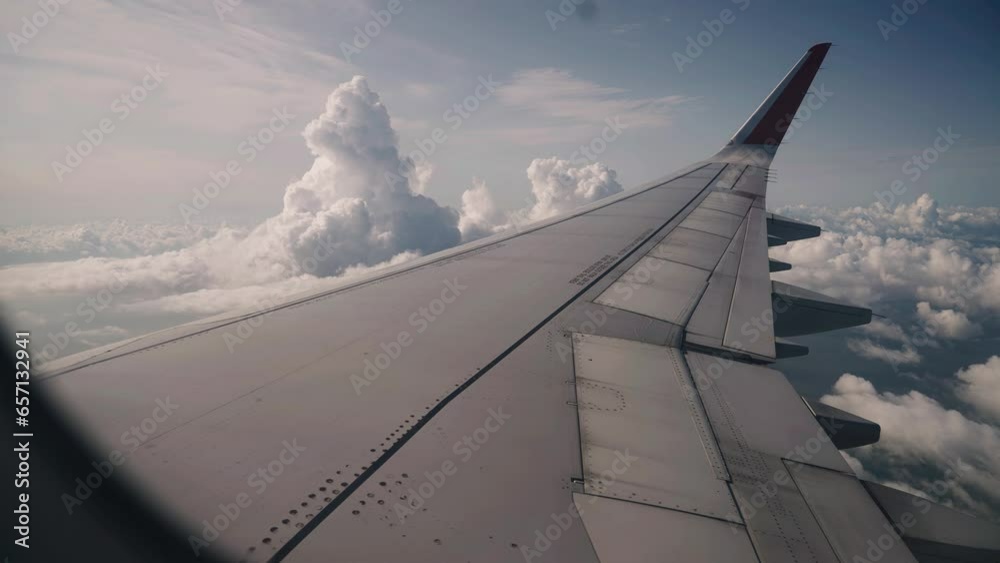 Stunning beautiful clouds are visible from the window of the plane while driving. Cool shots in flight Stunning beautiful clouds are visible from the window of the plane while driving. Cool shots in flight