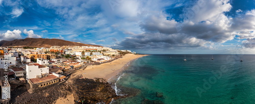 Morro Jable, Fuerteventura, Spain. Breathtaking beach Playa del Matorral in the rays of the sunset. Morro Jable and Playa del Matorral, Fuerteventura, Canary Islands, Spain, Atlantic, Europe