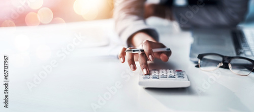 Person, hand and calculator for finance, budget planning or accounting audit on mockup at office. Closeup of accountant or employee in financial management, profit or expenses on bokeh background