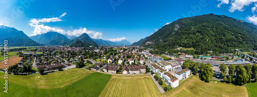 Aerial view over the city of Interlaken in Switzerland. Beautiful view of Interlaken town  Eiger  Monch and Jungfrau mountains and of Lake Thun and Brienz. Interlaken  Bernese Oberland  Switzerland.