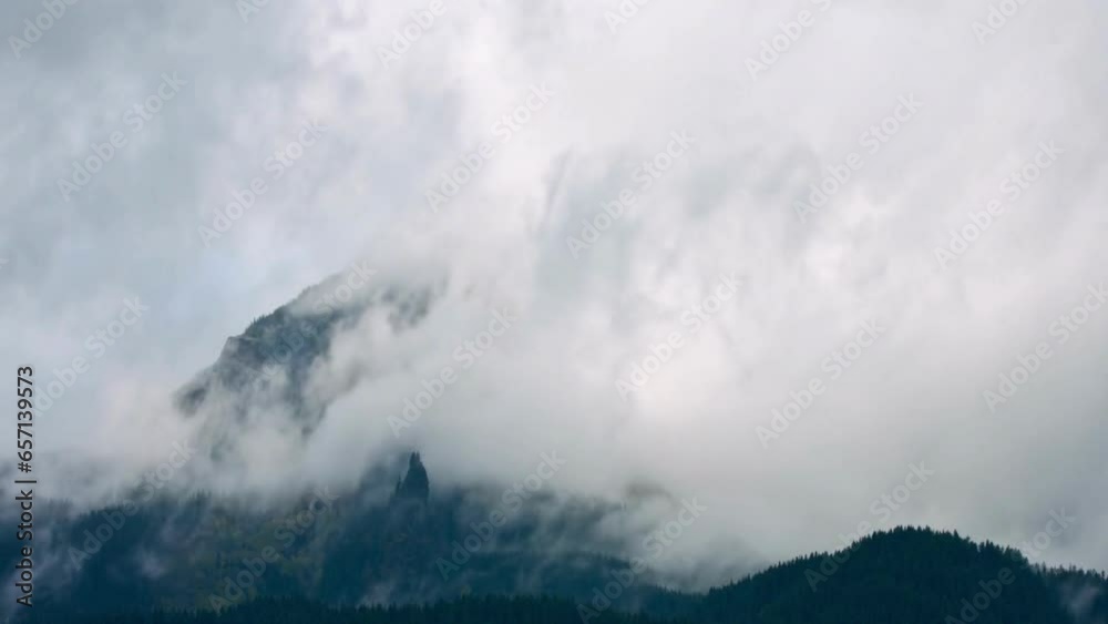 Dramatic 4K Time-Lapse: Stormy White Clouds Enveloping a Majestic Mountain Dramatic 4K Time-Lapse: Stormy White Clouds Enveloping a Majestic Mountain