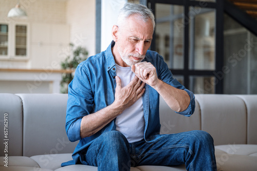 Slika na platnu Mature man suffering from dry cough and chest pain