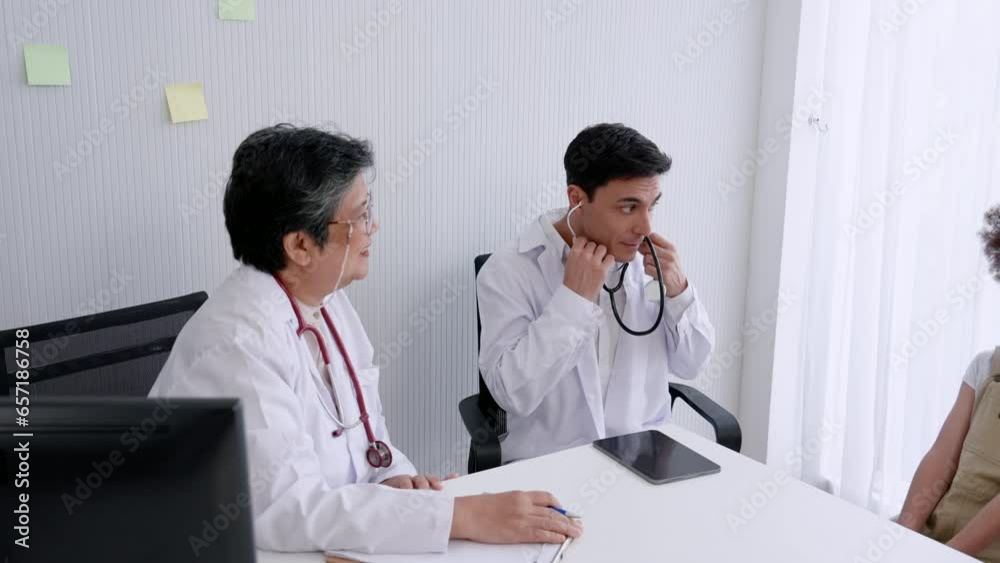 Hispanic Caucasian doctor, Checking the illness of a child patient Measure temperature on forehead and use a stethoscope to listen to sounds from the lungs According to the advice of the pediatrician Hispanic Caucasian doctor, Checking the illness of a child patient Measure temperature on forehead and use a stethoscope to listen to sounds from the lungs According to the advice of the pediatrician