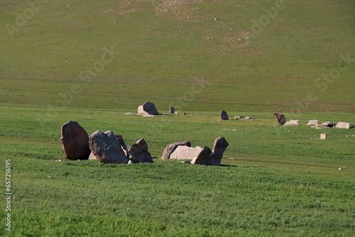 Deer stone monuments and square graves of Temeen Chuluu, Mongolia photo