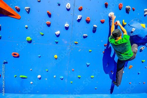 Details of a climber showed in detail as they take part in a competition in an artificial wall in Valaldolid, Spain