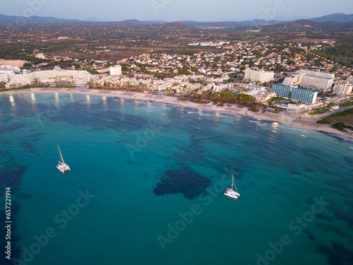 Aerial view from drone of coastal resorts before sunrise, Sa Coma, Malorca, Spain