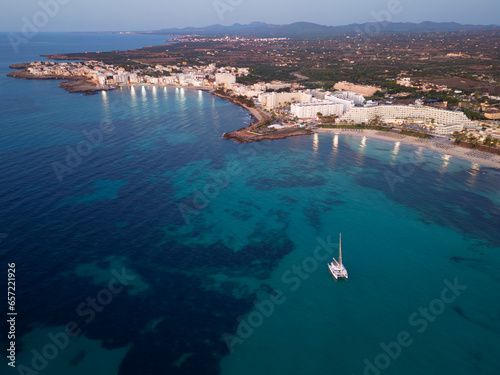 Aerial view from drone of coastal resorts before sunrise, Sa Coma, Malorca, Spain